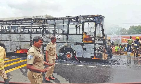 Fully burnt private bus which was involved in the accident near Veerapandi in Theni on Sunday