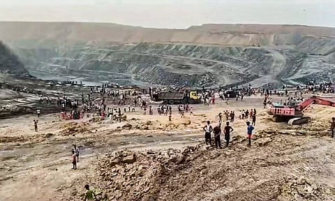 Charred remains of a vehicle parked at a coal mine where a blast occured (PTI)