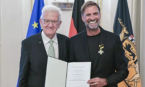 Soccer coach Juergen Klopp, right,receives the order of Merit of the German state of Baden-Wuerttemberg in Stuttgart, Germany (AP)