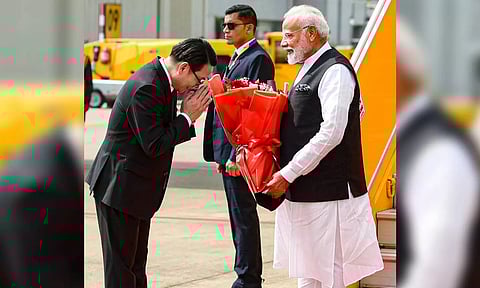Prime Minister Narendra Modi being received on his arrival, in Vientiane, Laos (PTI)