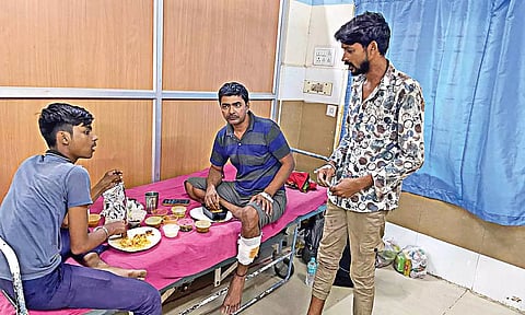 Nitish Kumar eating with his father Vinoth Kumar, and Netranandha Sahu