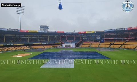 Covers remain on at the M Chinnaswamy Stadium delaying the start of the first Test (Justin George) 