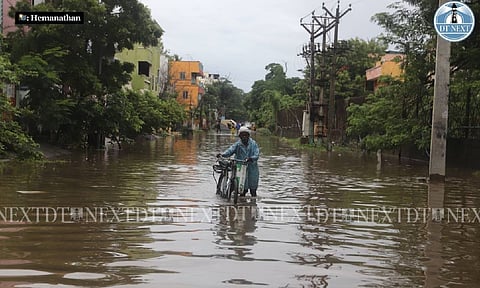 Residents passing through the water logged areas in Chennai (Photo: Hemanathan.M)