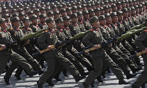 North Korean soldiers march during a mass military parade in Pyongyang’s Kim Il Sung Square to celebrate 100 years since the birth of North Korean founder (AP)