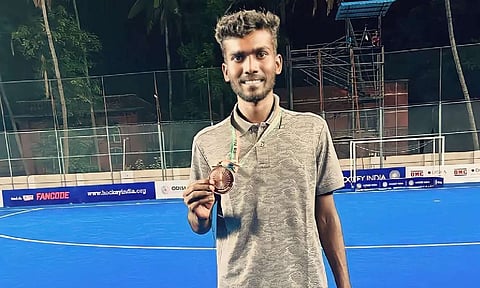 M Dhilipan with the Senior Nationals bronze medal