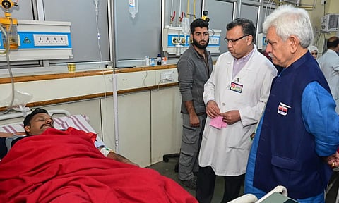 Lt. Governor Manoj Sinha visits a labourer who suffered injuries in a terrorist attack in J&K (PTI)