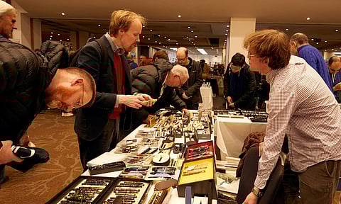 Customers view a selection of pens on display during the London Autumn Pen Show taking place in London, on Oct. 13, 2024. For collectors and enthusiasts at the London Pen Show, the finest writing instruments can cost thousands of dollars. (Ayesha Kazim/The New York Times)