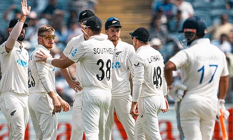 New Zealand players celebrate after taking a wicket on Day 2 (PTI)
