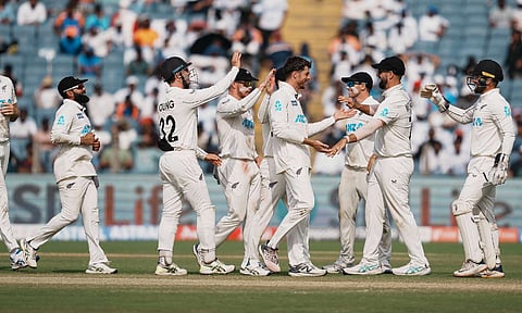 New Zealand's Mitchell Santner celebrates with teammates after taking the wicket of India's Ravichandran Ashwin (PTI)