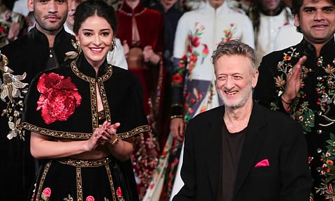 In this Sunday, Oct. 13, 2024 file image, actor Ananya Panday with designer Rohit Bal on the ramp during the grand finale of Lakme Fashion Week, in New Delhi. (PTI Photo)