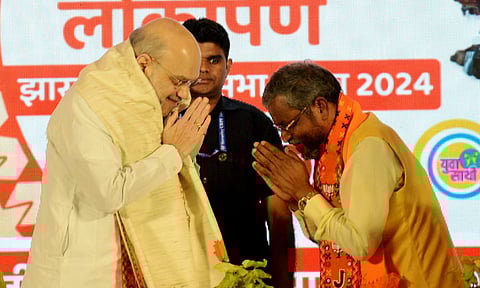 Union Minister and senior BJP leader Amit Shah with Jharkhand BJP President Babulal Marandi at the release of the party's Sankalp Patra (PTI)