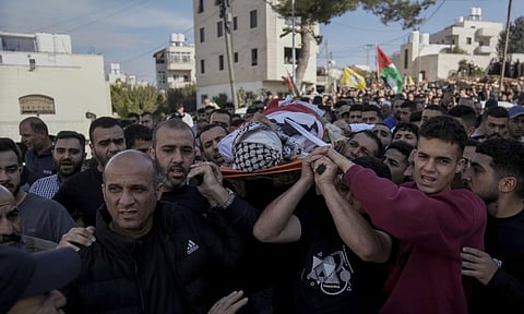 Mourners carry the body of Naji al-Baba, who the Palestinian health ministry said was killed by Israeli forces 