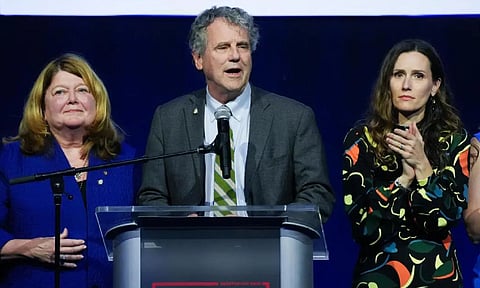 Democratic Ohio Sen, next to his wife Connie Schultz, left, and his daughter Elizabeth Brown, right.(AP Photo/Joshua A. Bickel)