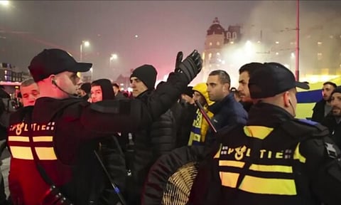 Police escort Maccabi Tel Aviv supporters (AP)