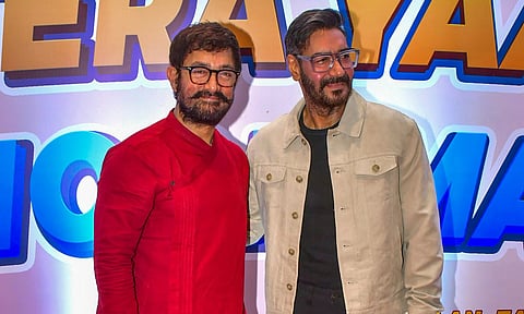 Bollywood actors Aamir Khan and Ajay Devgn during the 'Muhurat' of the upcoming film 'Tera Yaar Hu Main' (PTI)