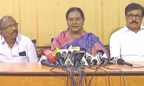 Image of Premalatha Vijayakanth talking to the reporters 
