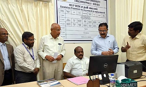 Minister Govi Chezhiaan checking the functioning of the help desk at Bharathidasan University in Tiruchy on Tuesday