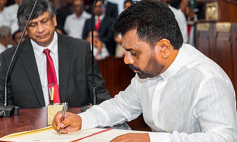 Anura Kumara Dissanayake signs documents after taking oath as Sri Lanka's new president during a ceremony, in Colombo (PTI) 