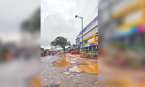 The damaged road along Senthil Nagar signal in Kolathur affects smooth flow of traffic, posing tripping hazards for motorists