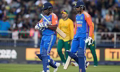India's Sanju Samson, left, and his batting partner Tilak Varma walk between the wickets during the fourth T20 cricket match (PTI) 