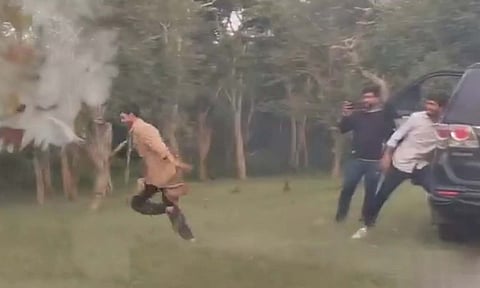 Screenshot from the video showing three youngsters scaring off the herd