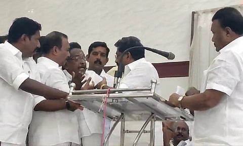 AIADMK cadre arguing with the organisers of the district-level review meeting in Kumbakonam on Friday