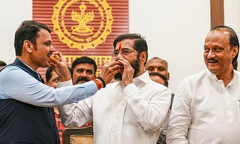 Maharashtra Chief Minister Eknath Shinde with Deputy Chief Ministers Devendra Fadnavis and Ajit Pawar celebrates the BJP-led Mahayuti alliance's lead amid the counting of votes for the Maharashtra Assembly elections (PTI)