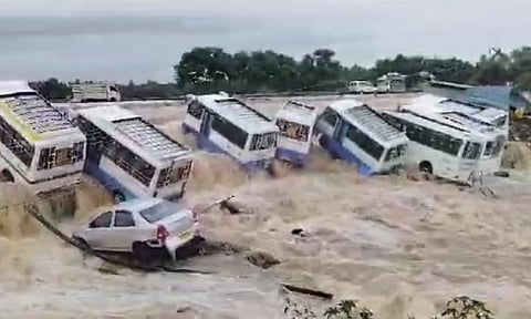 Tourist vehicles washed away in floods in Uthangarai