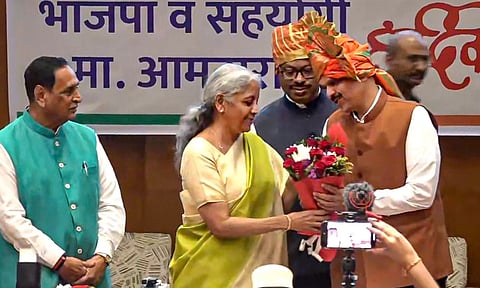 Union Finance Minister Nirmala Sitharaman felicitates BJP leader Devendra Fadnavis after he was unanimously elected as the Maharashtra BJP legislature party leader at its meeting, in Mumbai (PTI) 