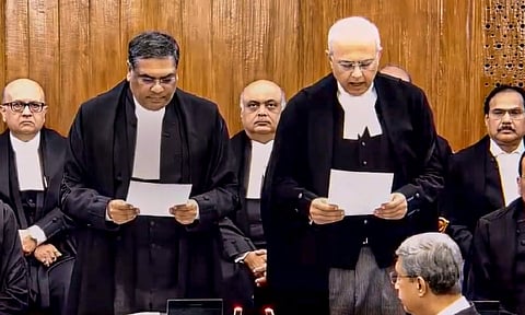 Chief Justice of India Sanjiv Khanna administers the oath of office to Justice Manmohan as a judge of the Supreme Court, in New Delhi.