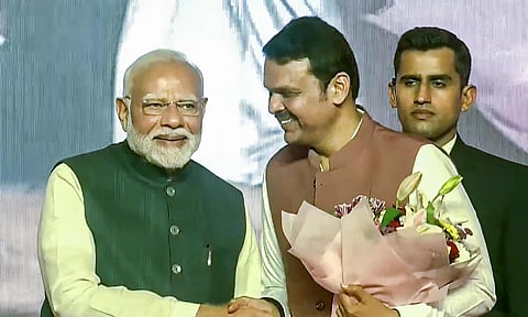 Prime Minister Narendra Modi with BJP leader Devendra Fadnavis during the swearing-in ceremony in Mumbai (PTI)
