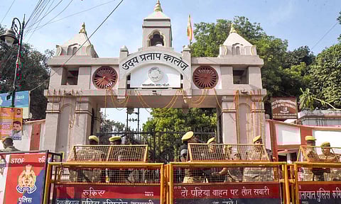 Police and security personnel stand guard outside Udai Pratap College amid protest by students demanding removal of a mosque located on the institute's campus, in Varanasi (PTI) 