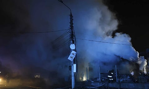 Smoke rises from a building in Ukraine due to Russian airstrikes (AP)