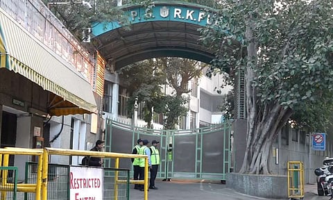 A police personnel enters into DPS RK Puram to conduct investigation after it received bomb threat, in New Delhi, Monday, Dec. 9, 2024. GD Goenka School at Paschim Vihar also received a bomb threat. (PTI) 