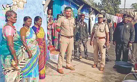 Forest staff during an enquiry with estate workers in Valparai