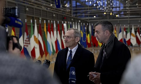 Hungary's Interior Minister Sandor Pinter speaks with the media during arrivals for a meeting of EU justice and interior ministers at the European council building in Brussels (AP)