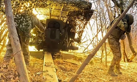 This photo is taken from a video released by Russian Defense Ministry press service on Wednesday, Dec 11, 2024, Russian servicemen fire a D-20 howitzer towards Ukrainian positions in an undisclosed location (AP)