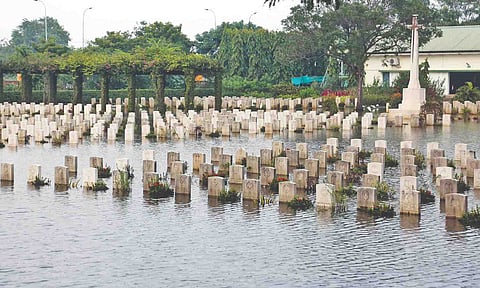 Graves remain submerged at the cemetery since Thursday (Justin George)