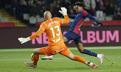 Barcelona's Lamine Yamal and Leganes' goalkeeper Marko Dmitrovic (AP)