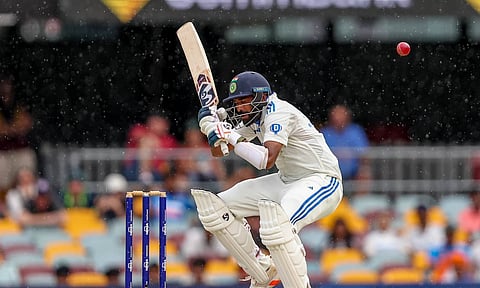 India's Mohammed Siraj ducks to avoid a bouncer as he bats during play on day four of the third cricket test between India and Australia at the Gabba in Brisbane