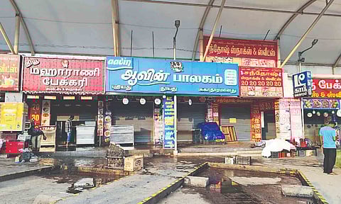 Shops closed for business at the Tirupur bus stand protesting against hiking property tax and levying GST on rental income on Wednesday