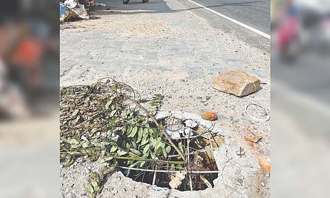 The open and damaged manhole on Kakkalur Bypass Road in Tiruvallur