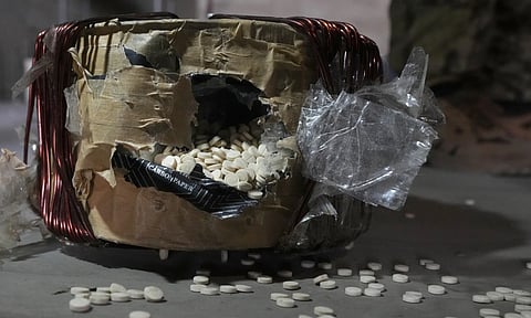 Amphetamine pills known as Captagon hidden inside an electrical component at the warehouse where the drug was manufactured before the fall of Bashar Assad government at a facility in Douma city, outskirts of Damascus, Syria (AP)