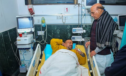 Defense Minister Rajnath Singh meets BJP MP Mukesh Rajput undergoing treatment at the RML Hospital after he got injured in clashes between INDIA Bloc and NDA MPs during protest at Parliament complex, in New Delhi (PTI)