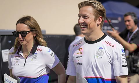 RB driver Liam Lawson of New Zealand walks through paddock ahead of the Formula One Abu Dhabi Grand Prix, at the Yas Marina Circuit in Abu Dhabi, UAE (AP Photo)