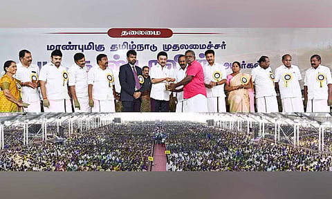 Chief Minister MK Stalin giving away welfare assistance to a beneficiary in Erode on Friday
