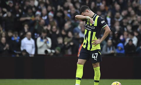 Manchester City's Phil Foden reacts after Aston Villa's Morgan Rogers scoring his side's second goal during the English Premier League soccer match between Aston Villa and Manchester City (AP)