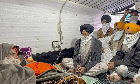 Shiromani Gurdwara Parbandhak Committee (SGPC) President Harjinder Singh Dhami meets farmer leader Jagjit Singh Dallewal, who is on an indefinite fast at Khanauri border at Khanauri border since November 26, in Sangrur district, Punjab, Wednesday, Dec. 18, 2024 (PTI) 