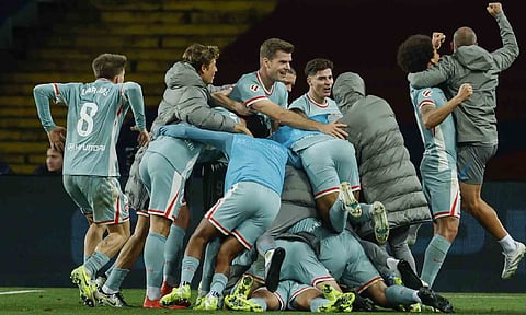 Atletico Madrid players celebrate their victory goal during the Spanish La Liga soccer match (AP)