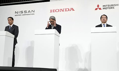 (L-R) Nissan Chief Executive Makoto Uchida, Honda Chief Executive Toshihiro Mibe and Takao Kato CEO of Mitsubishi Motors, right, attend a joint news conference (AP)